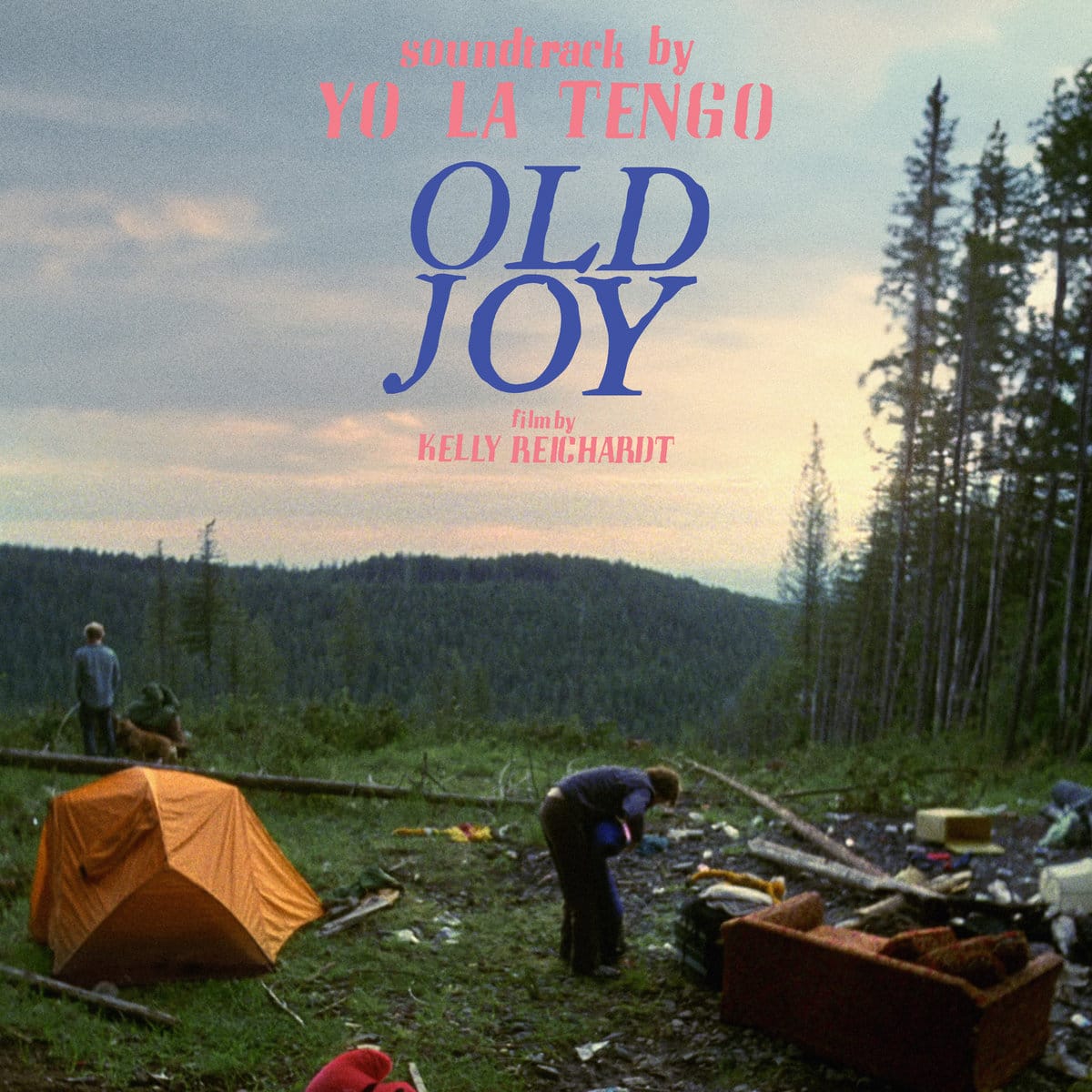 Cover of the vinyl album soundtrack to the film Old Joy by Yo La Tengo showing two men at a makeshift camp in the Oregon woods, as one takes a pee and another looks at an abandoned couch.