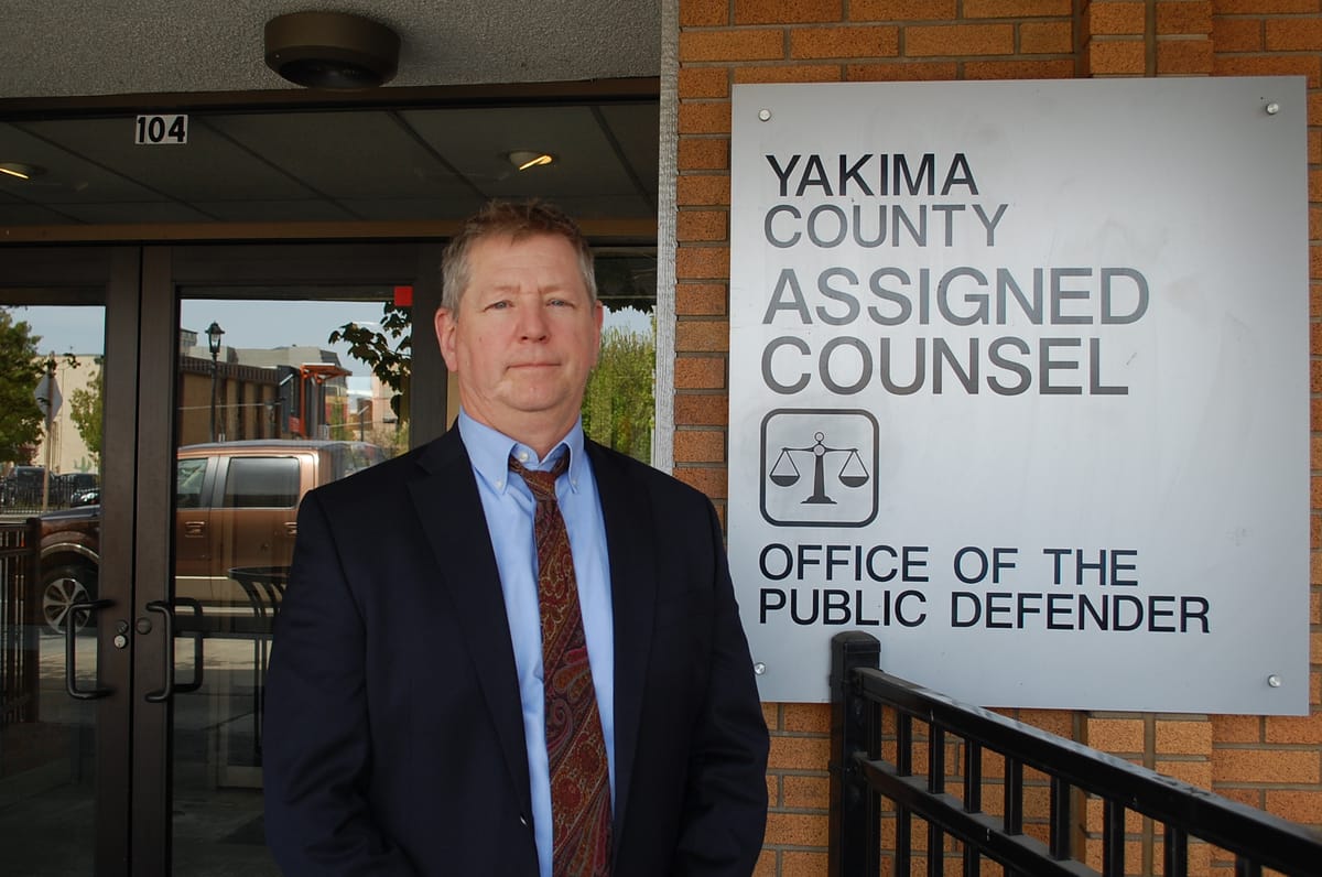 Paul Kelley, director of Yakima Office of the Public Defender, stands outside his office.