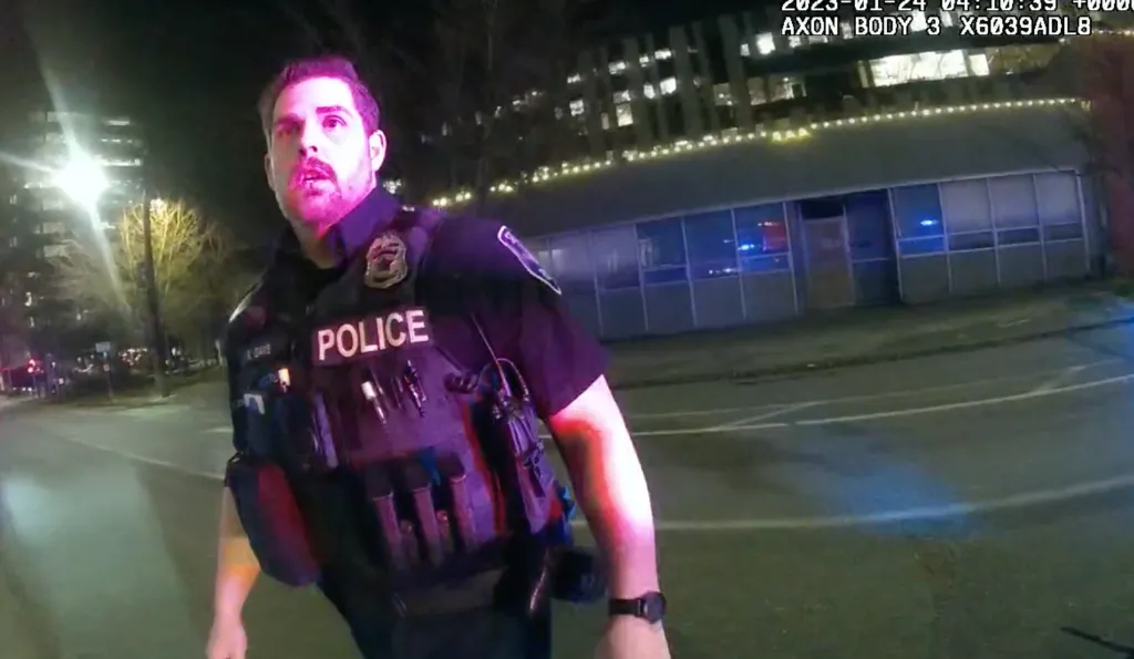 Seattle police officer Kevin Dave, in an image from body cam video, stands looking shocked after he struck and killed a pedestrian in a Seattle crosswalk in 2023.