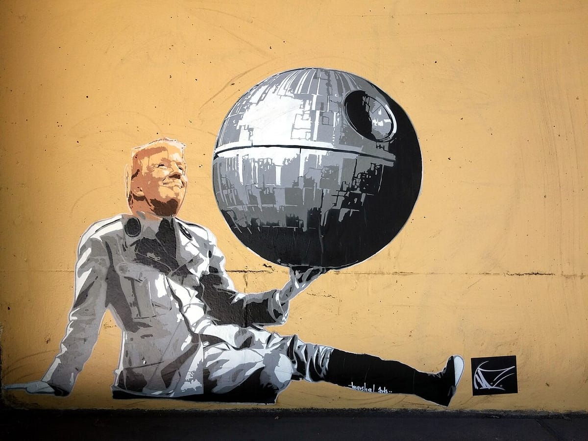 A mural depicts Donald Trump in the uniform worn by Charlie Chaplin in the movie The Great Dictator and holding a model of the Death Star.