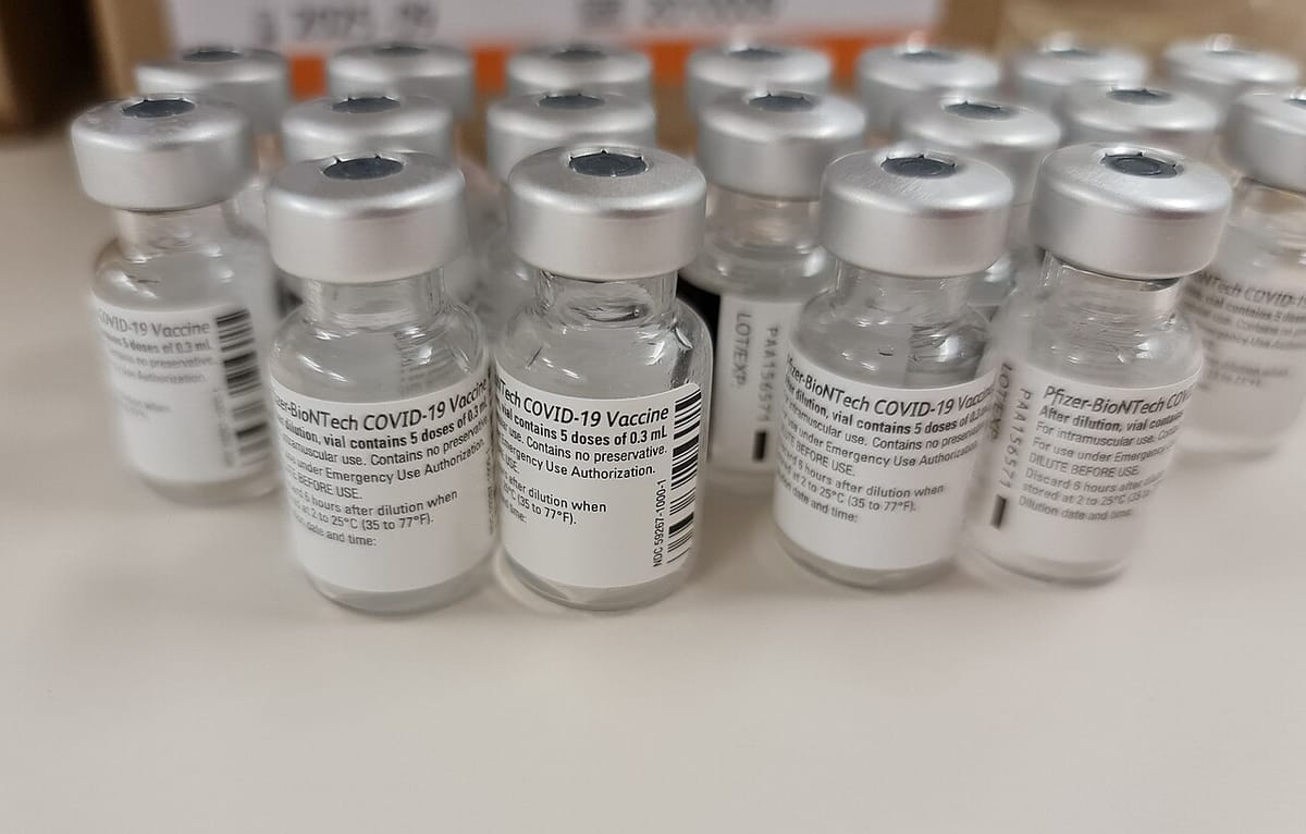 About twenty vials of COVID-19 vaccine.