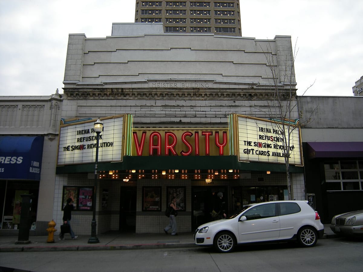 The front facade of the Varsity Theatre showing a marquee that lists movies Refusenik and the Singing Revolution.