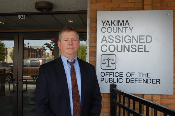 Paul Kelley, director of Yakima Office of the Public Defender, stands outside his office.