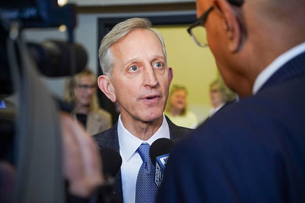 Portland mayor Keith Wilson speaks to a television reporter from KOIN.