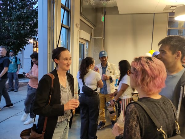 Mayoral candidate Katie Wilson chats with supporters at an event at El Centro de la Raza