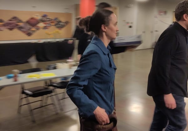 Katie Wilson strides into her election night party.