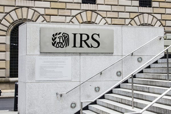 A stairway outside a government building with a sign reading IRS