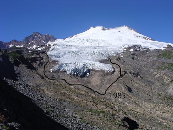 A glacier on a volcanic peak, with a line drawn showing that the glacier was much larger in 1985.