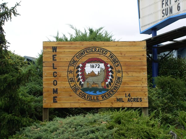 A sign welcoming visitors to the Confederated Tribes of the Colville Reservation, which it says encompasses 1.4 million acres.